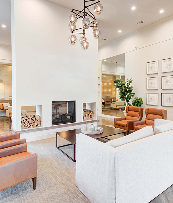 IMT Prestonwood - Resident Clubhouse with fireplace, love seat sofa, lounge chairs, coffee table