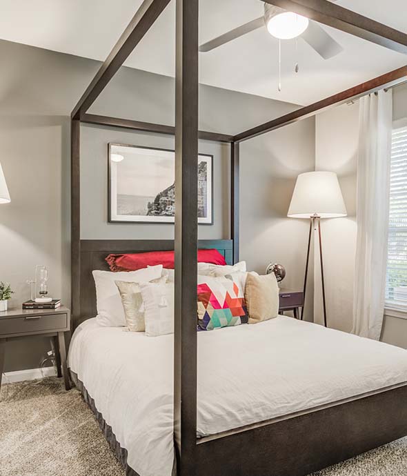 Apartment Amenities featuring furnished bedroom