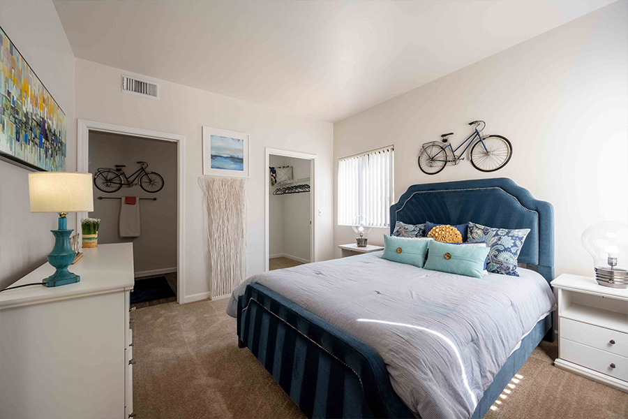 IMT Chandler - bedroom with carpert flooring and walkin in closet and bathrom to the left